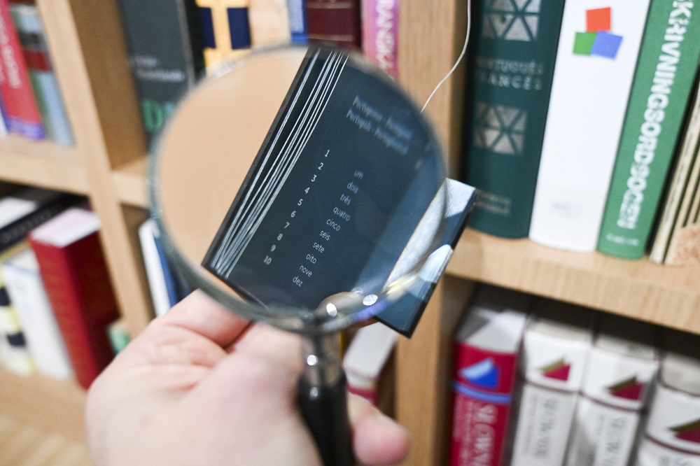 Magnifying glass in front of bookcase