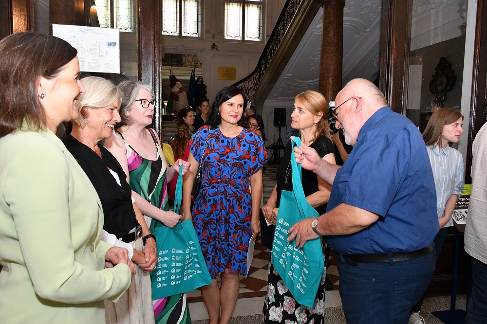 Curators meeting colleagues at opening event