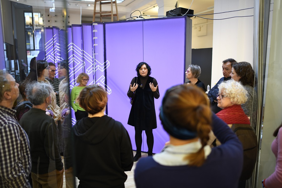 Curator giving tour in exhibition