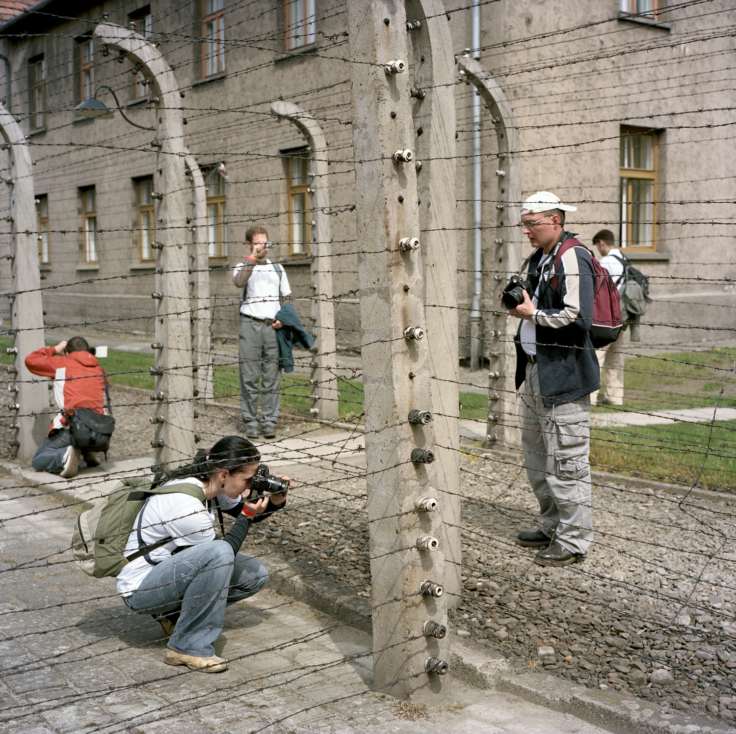Photographing barbed wire at the Auschwitz-Birkenau Memorial and Museum
