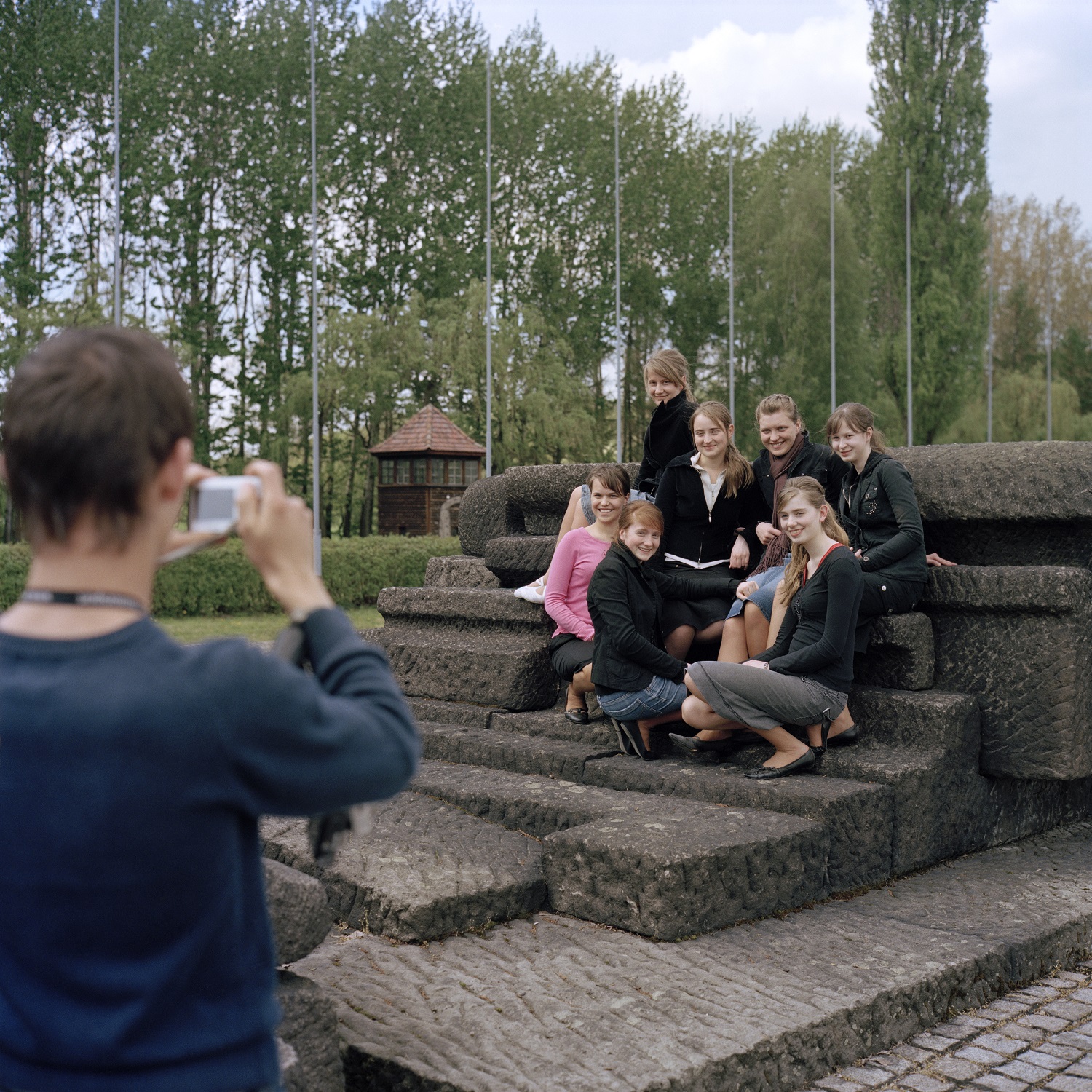 Group posing at former concentration camp