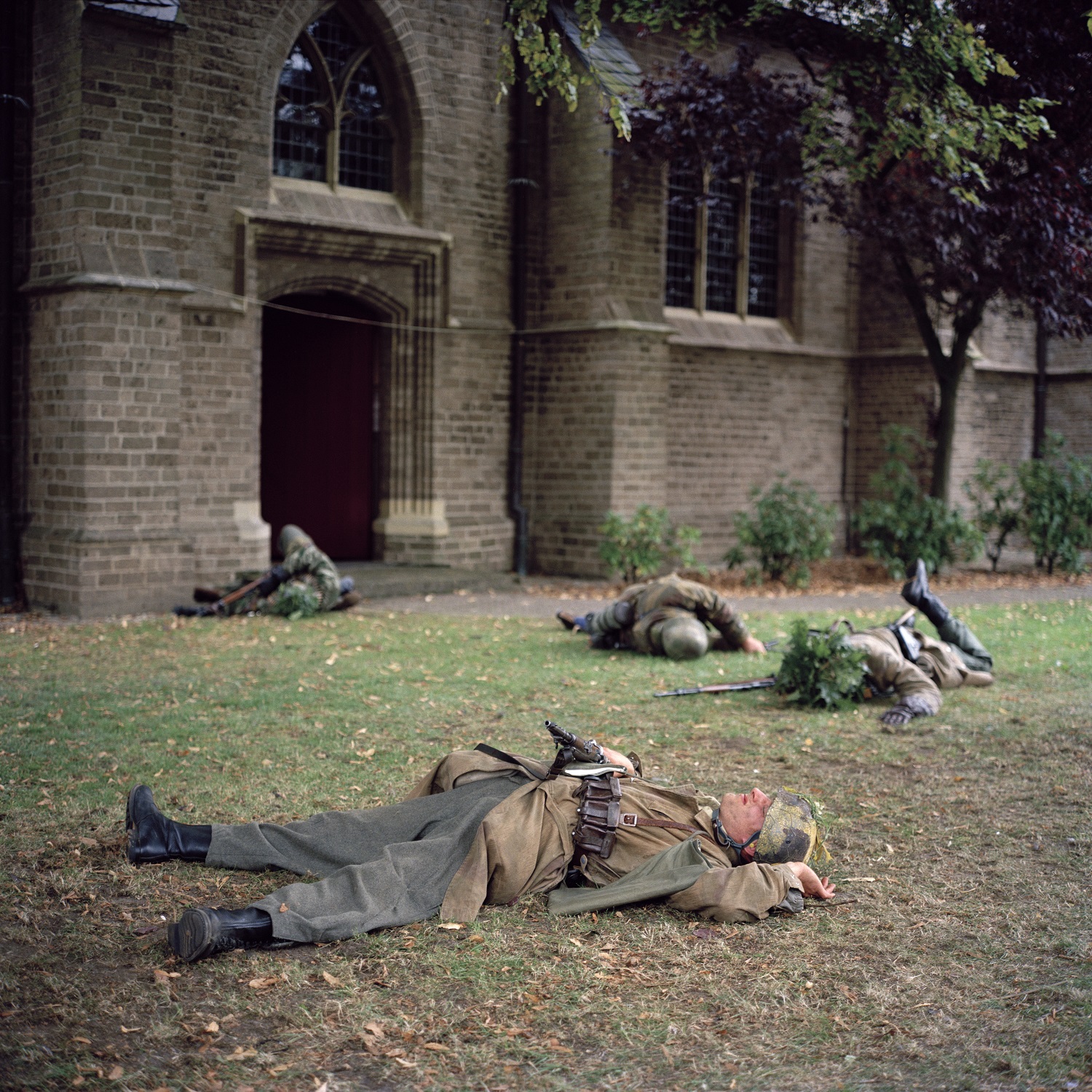Army reenactors laying on ground