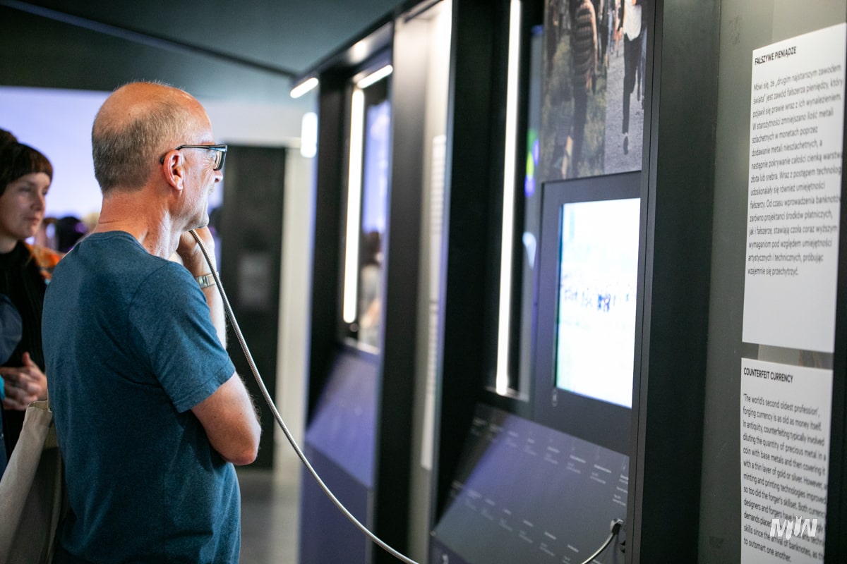 Man looking at display case