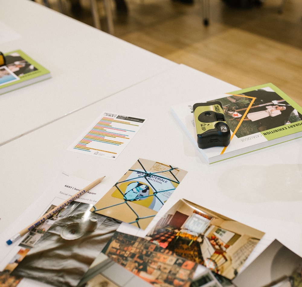 Photos and leaflets on table