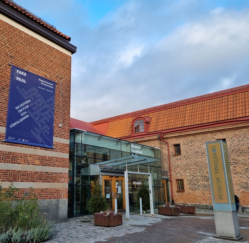 Museum building with Fake for Real banner