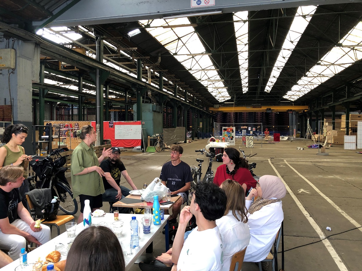 Young people around table in workshop
