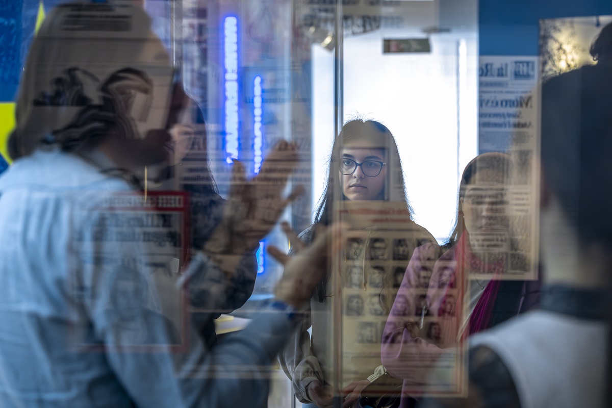 Woman in museum looking through display case