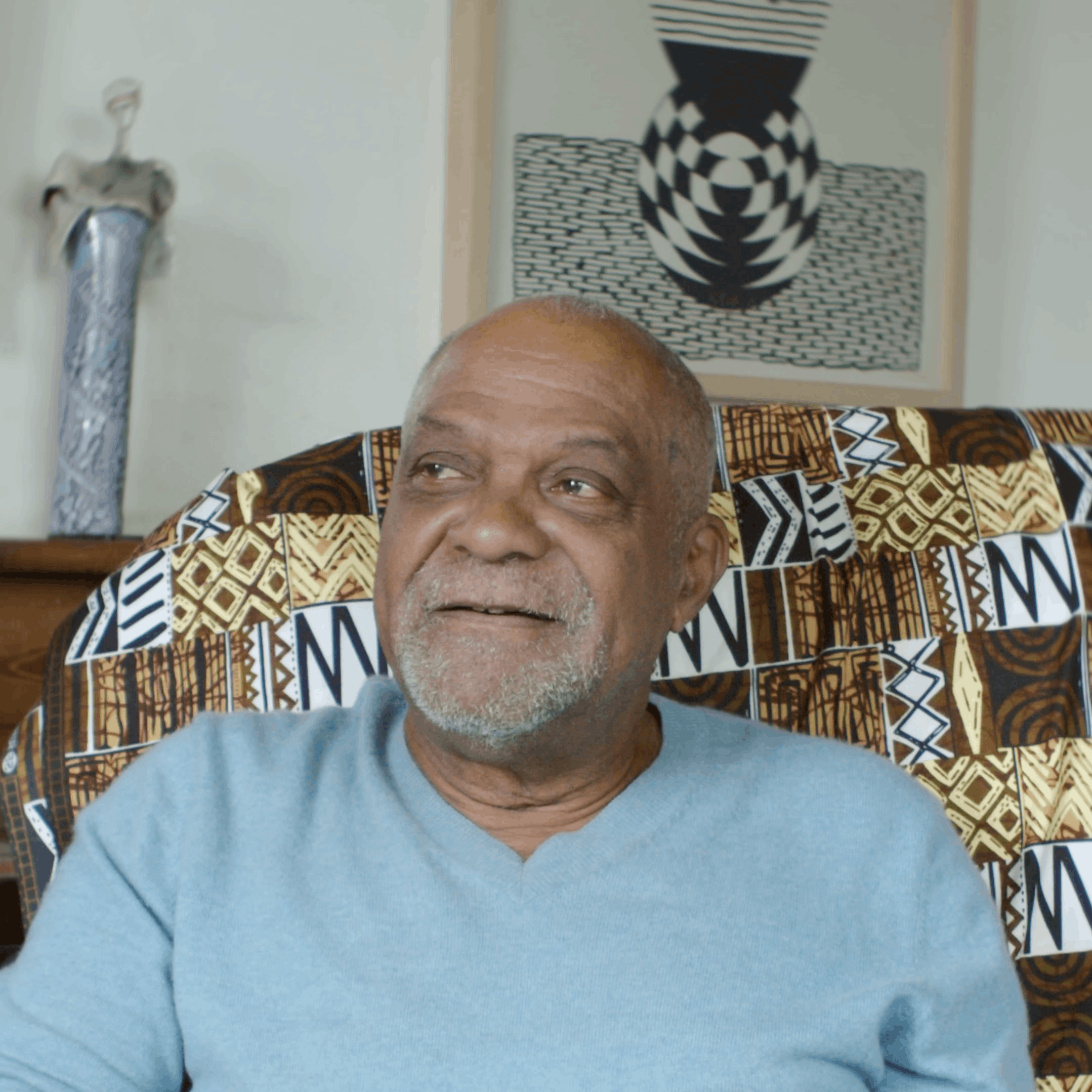 Man on sofa with blue top