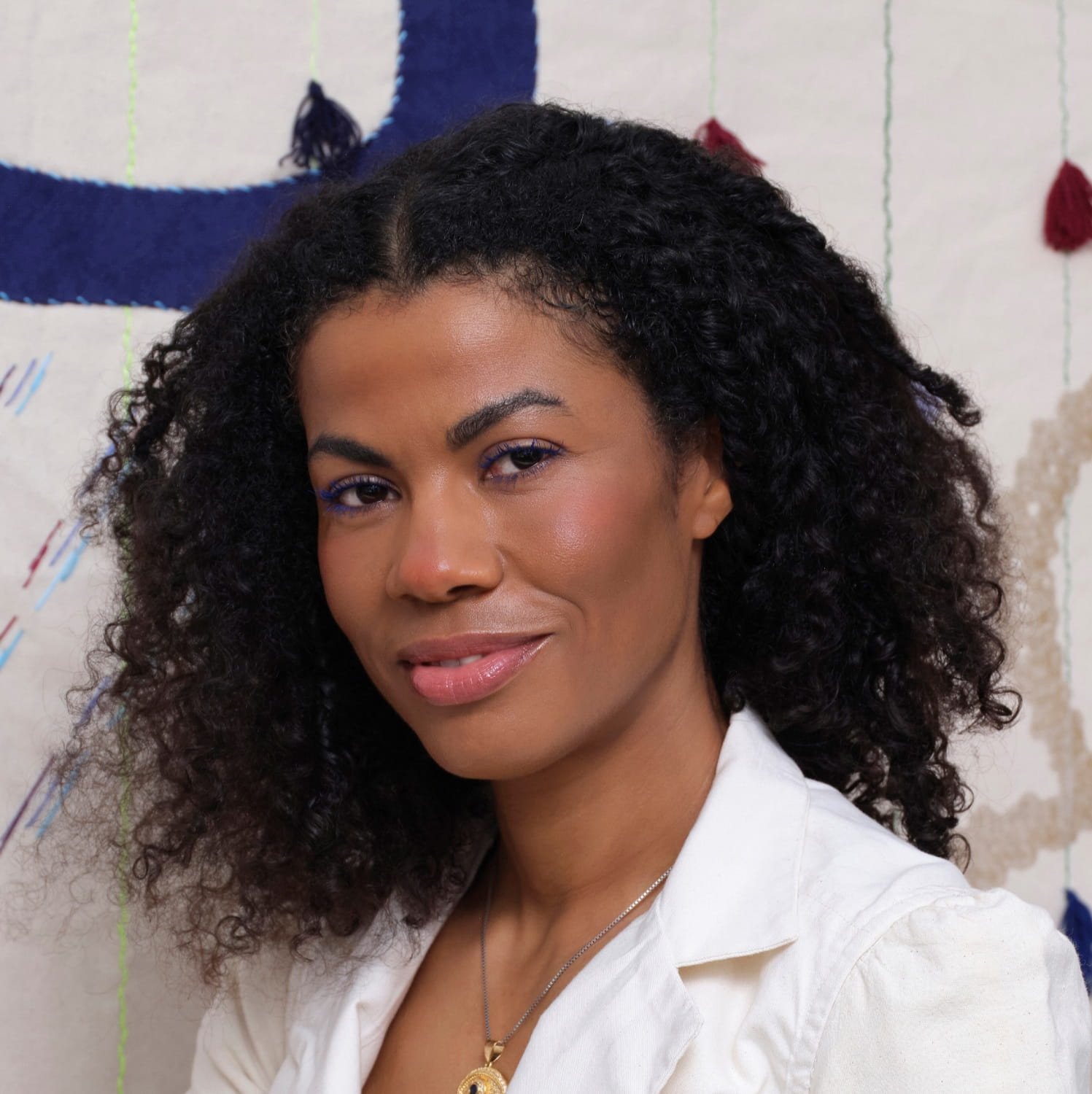 Headshot - woman in white jacket