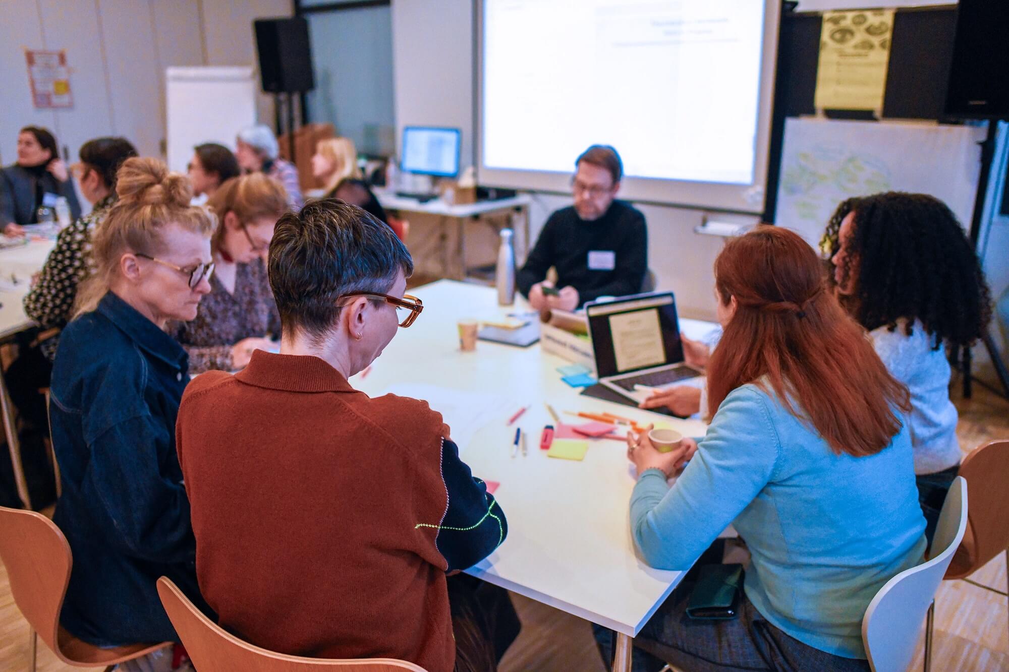 People around table brainstorming