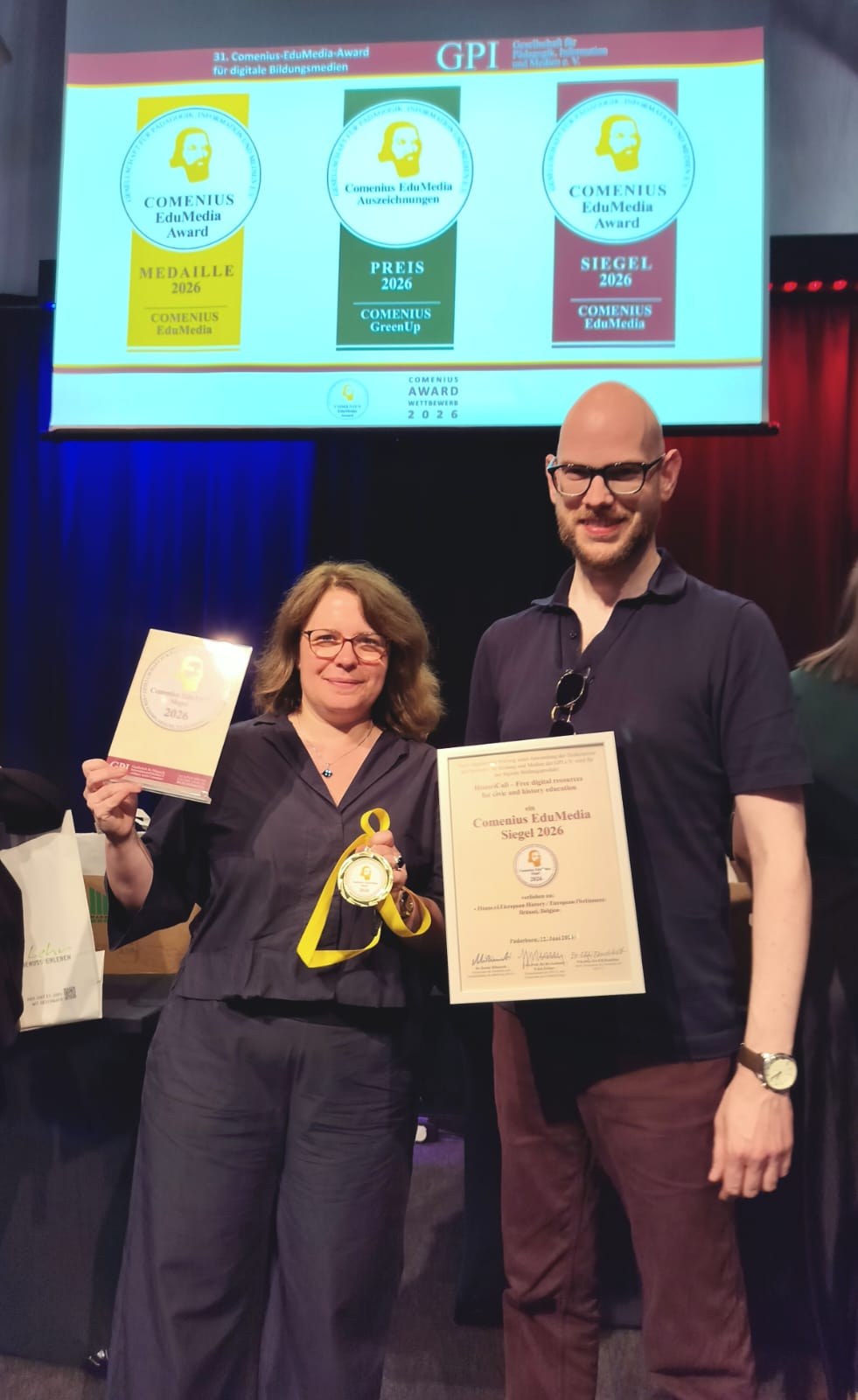 Woman and man with certificate