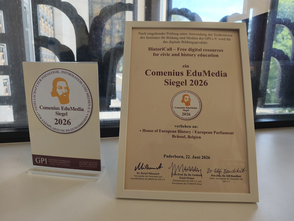 Framed certificate and award paper in museum