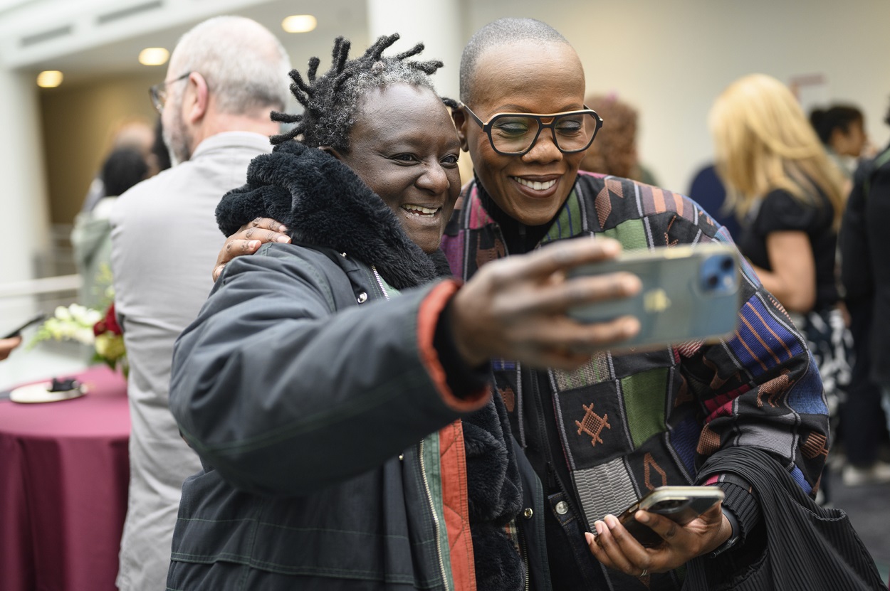 Two participants making a selfie at conference 