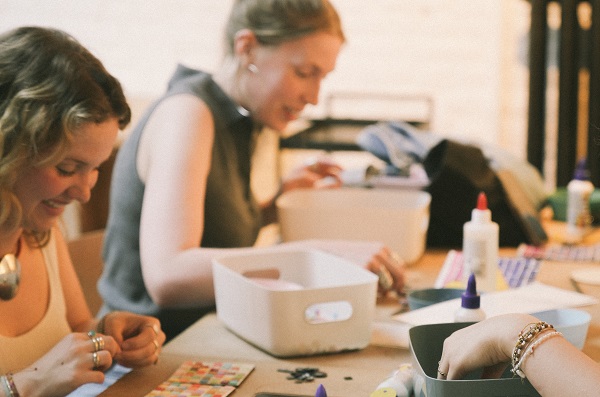 Two women creating crafts