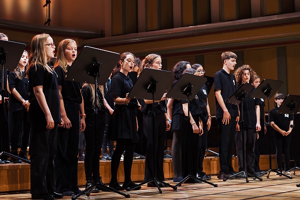 Children in black singing