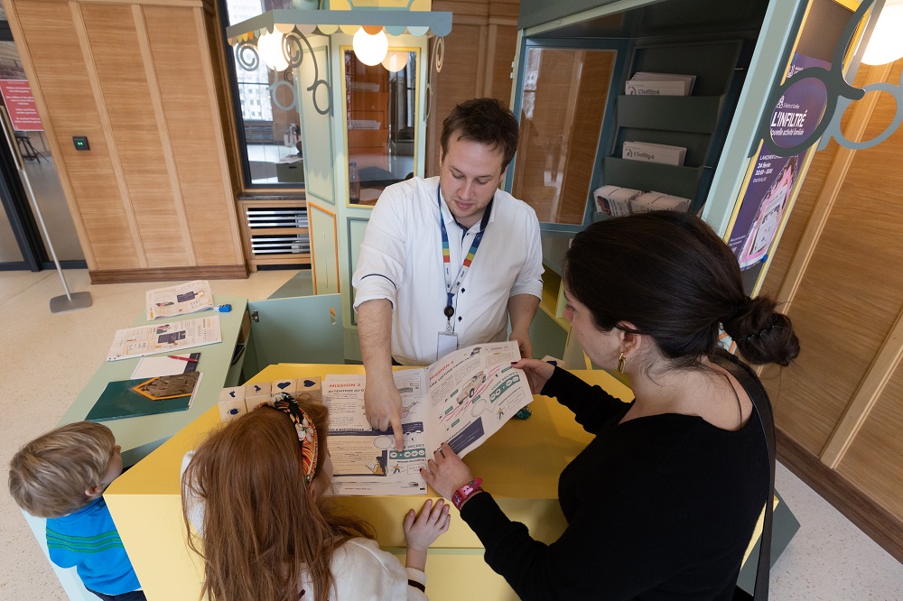 Family at desk in museum