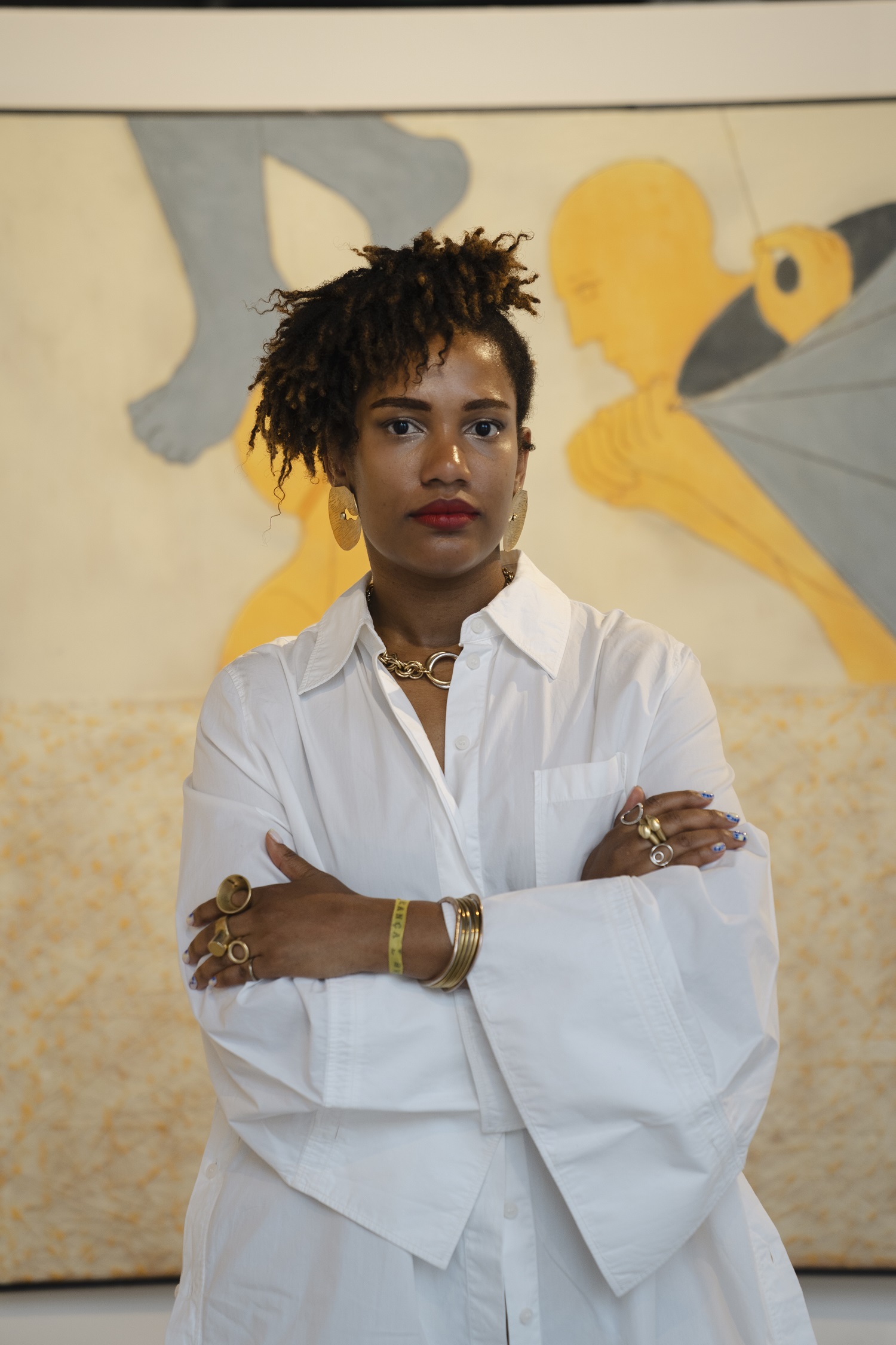 Woman in front of wall wearing white