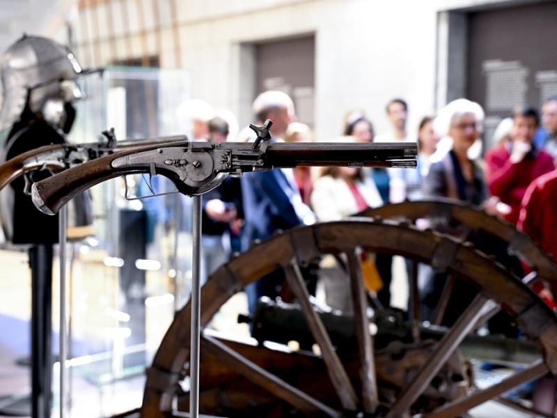Visitors looking at canon