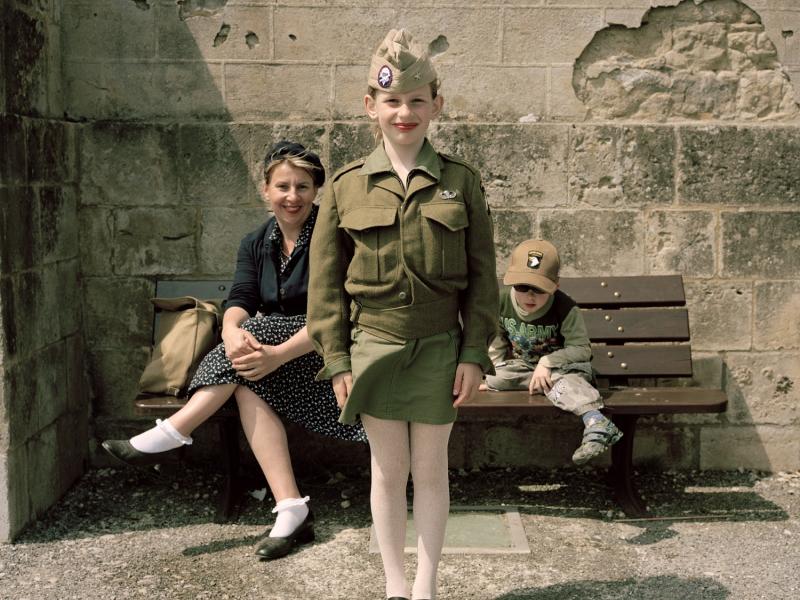 Young girl in army uniform smiling