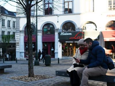 couple on bench in square