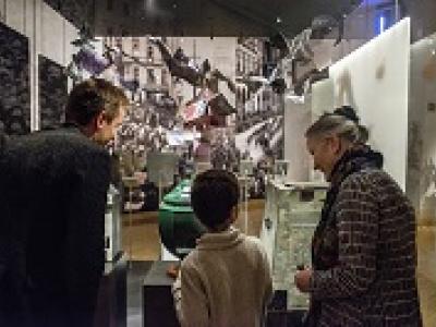 Child and two adults in museum