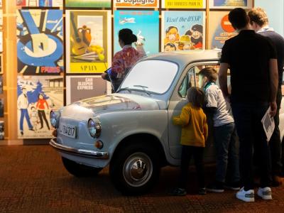 Family in Zastava car in museum