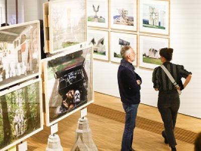 Two people in photography exhibition