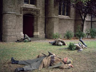 Army reenactors laying on ground
