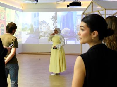 Woman giving speech in exhibition area