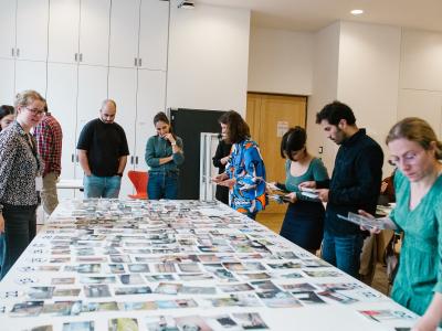 People looking at photos on desk