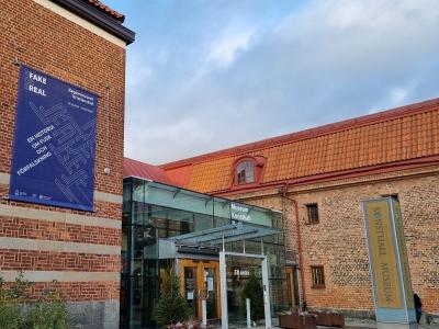 Museum building with Fake for Real banner