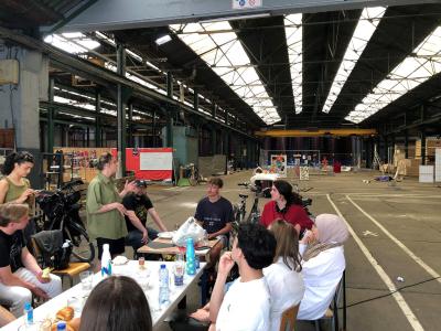 Young people around table in workshop