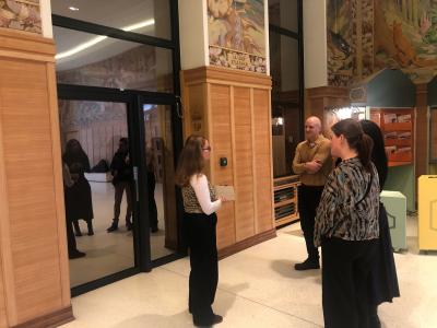 Group with guide in Fables Room of museum