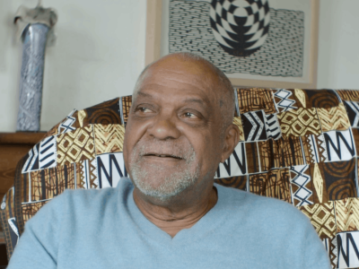 Man on sofa with blue top