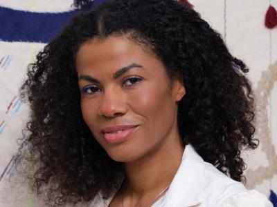 Headshot - woman in white jacket