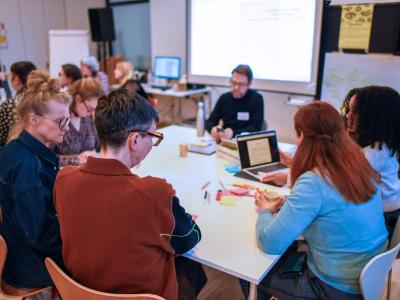 People around table brainstorming