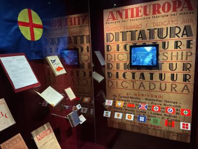 Showcase in museum with far right poilitical party badges