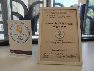 Framed certificate and award paper in museum