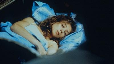 Woman in bed thinking