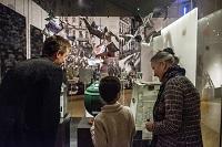 Child and two adults in museum