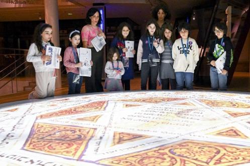 Childrens group in front of projected image