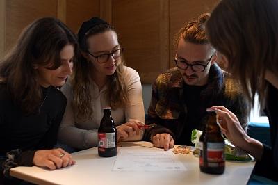 People doing a quiz around a table
