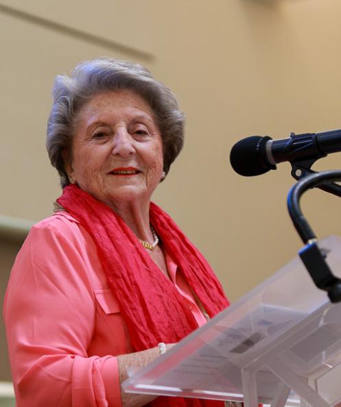 Woman giving speech with microphone