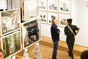 Two people in photography exhibition