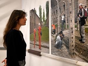 Woman looking at photo in exhibition
