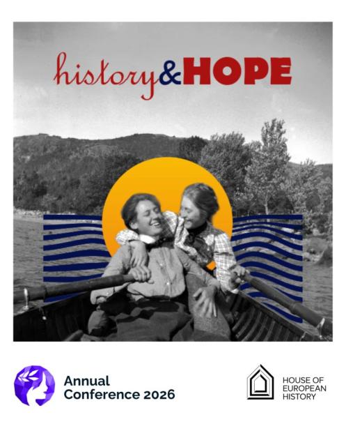 Two women in boat rowing together