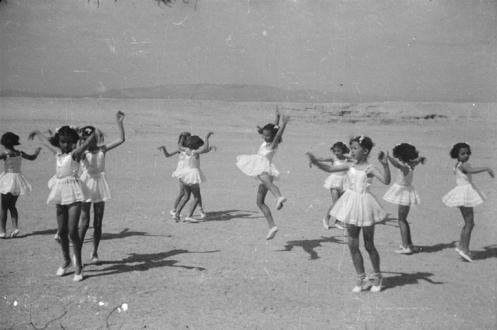 Girls dancing on beach