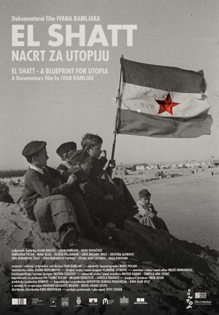People on beach with flag