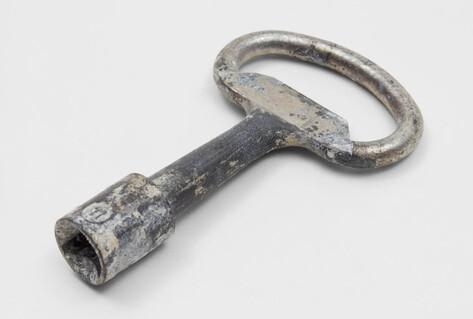 Silver key for bin