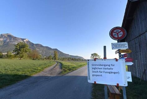 Road in countryside with sign saying border is closed